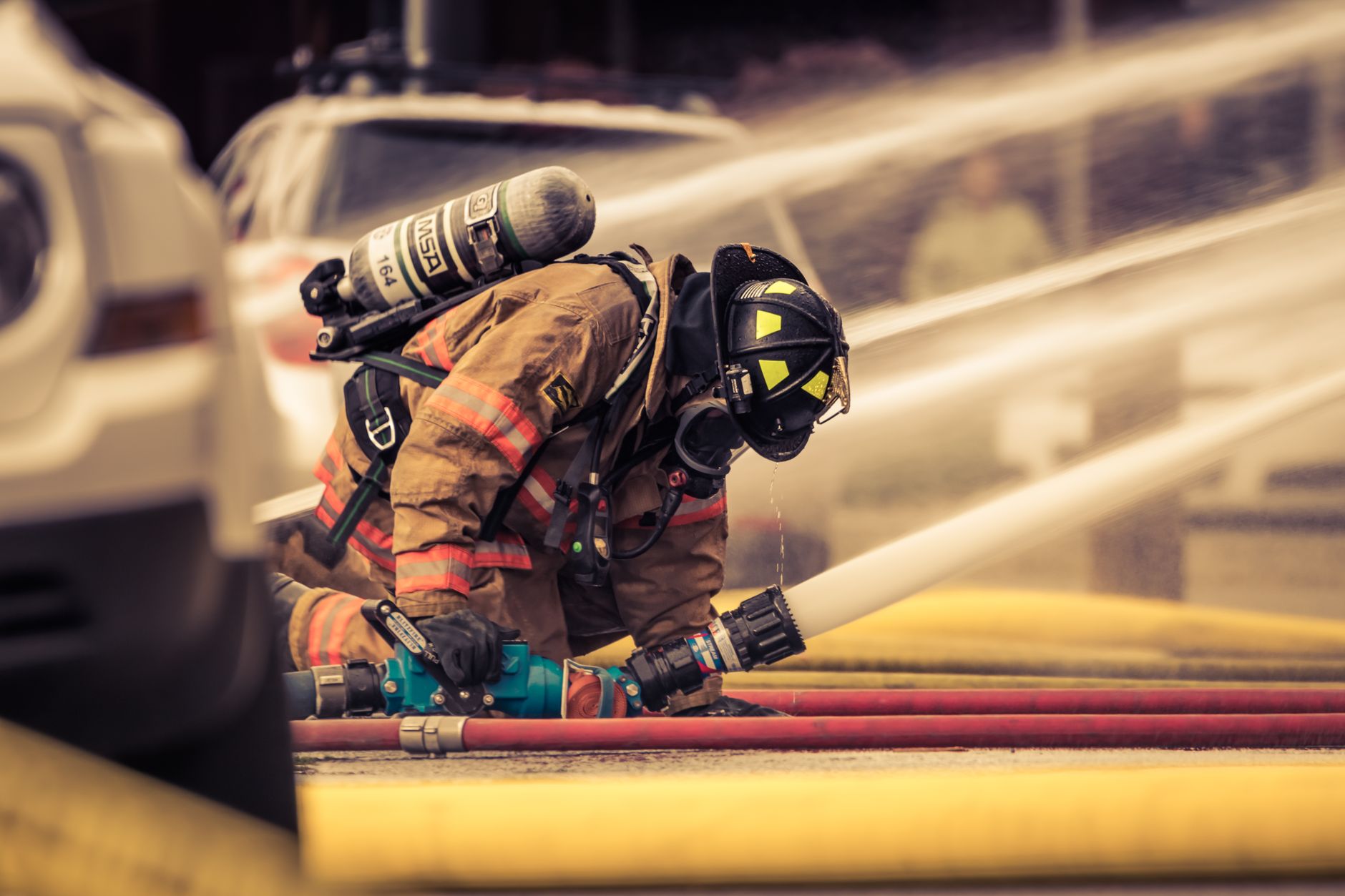 Retained firefighter in protective kit during training, representing the recruitment pressures at the heart of the retained firefighters crisis