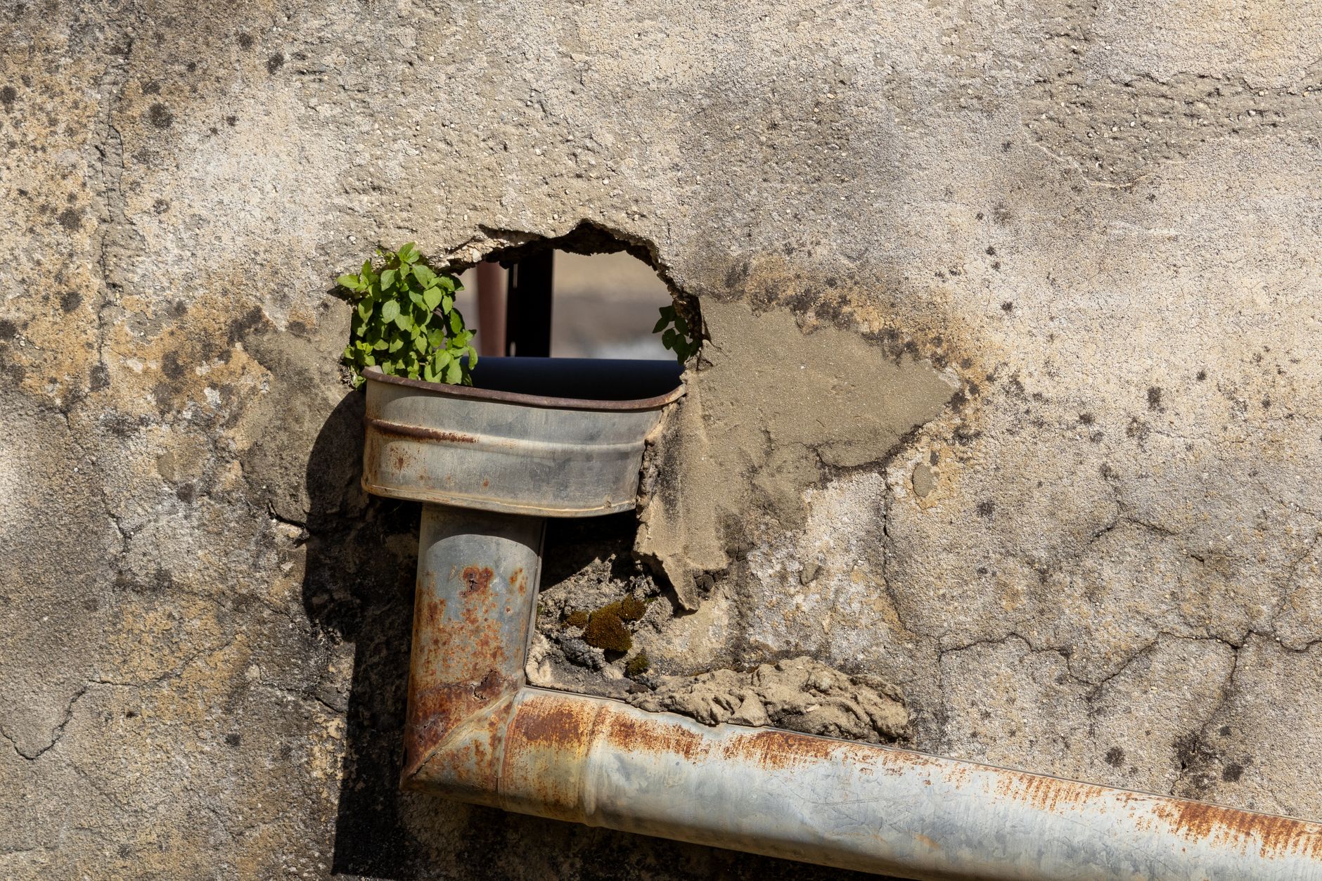 Sewage overflow pipe discharging into a river in England, illustrating the sewage discharge crisis