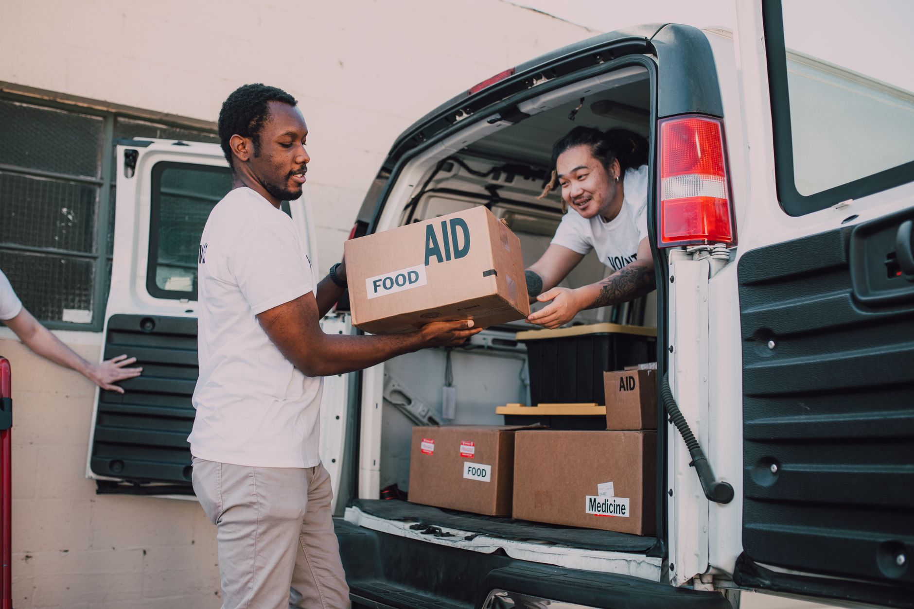 Volunteers packing emergency food parcels at a foodbank in Britain, reflecting the scale of foodbank use in Britain